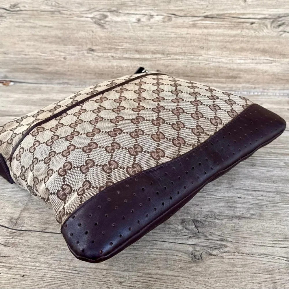 Gucci GG Monogram perforated leather messenger bag